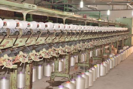 纺织制造指已提到的人纺织品工业工厂,制造关于粗绳照片